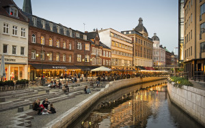 People relaxing at Aarhus river at dusk